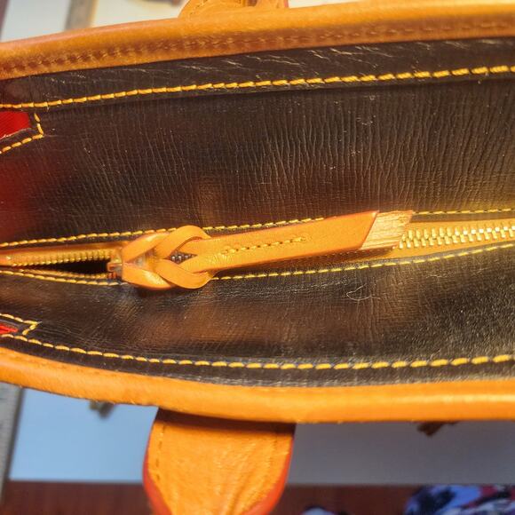 Dooney & Bourke Saffiano Tassel Bucket Tote Bag in black with tan trim - Picture 10 of 16